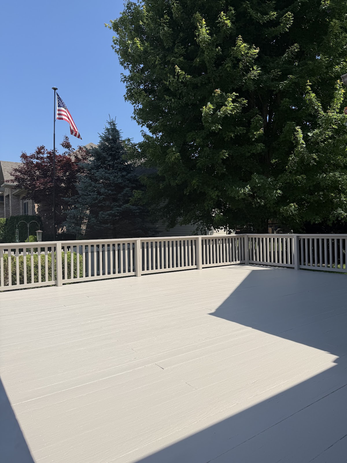 Freshly painted deck with white railings